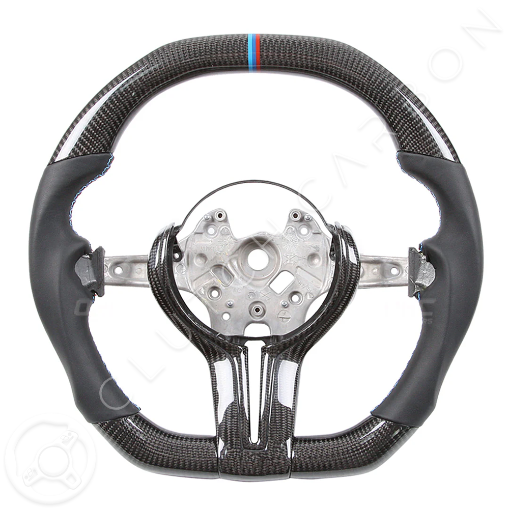 The BMW F-Series Custom Carbon Fiber Steering Wheel features an offset center and sporty design with a glossy finish, highlighted by a small blue and red stripe on top for a dynamic look.